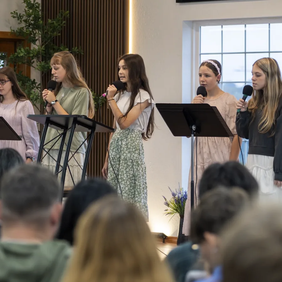 Young women singing during worship at Mission View Baptist